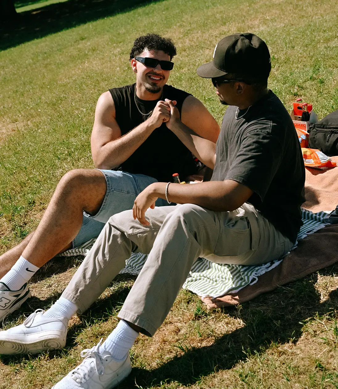 two friends sitting outside