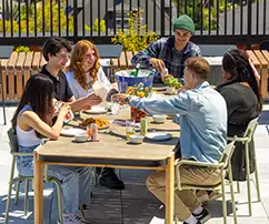 a group of friends eating outside
